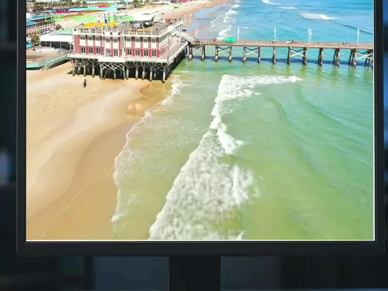 A website open on a desktop monitor, showing the Daytona Beach pier