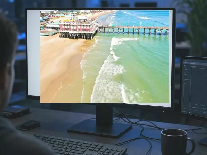 Desk setup with a website open on the monitor